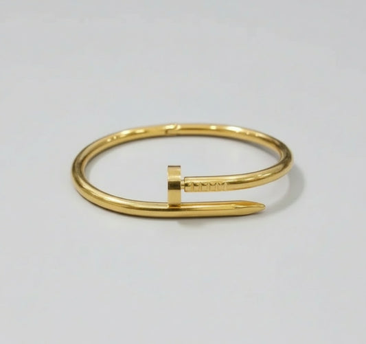 Gold bracelet on a white background