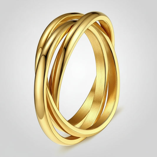 Gold ring with interlocking bands on a white background